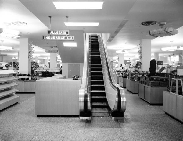 The new Sears store at 1101 East Washington Avenue features the second escalator in the city, as well as an Allstate Insurance counter and various merchandise display cases.