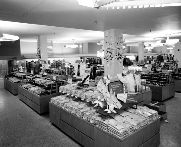 Men's clothing department with "island" counters and wall displays during the opening of the new Sears store at 1101 East Washington Avenue.