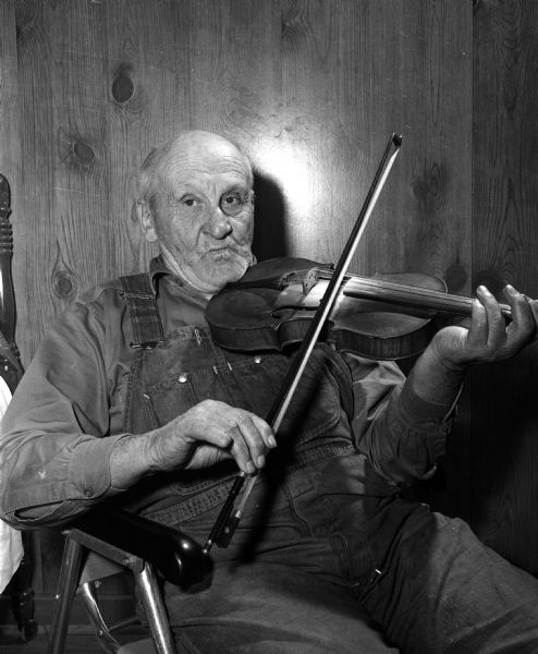Charlie Hemeyer, a resident at Rest Haven nursing home on Mineral Point Road, likes to play the fiddle for his own recreation as well as for the enjoyment of elderly patients who also live there.