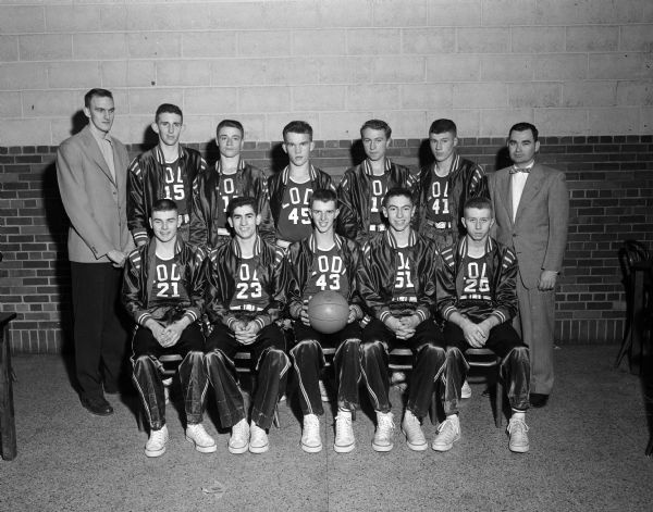 Group portrait of the Lodi High School boys basketball team in uniform with their two coaches, Bob Weber, upper left, and Wayne Nelson, upper right.