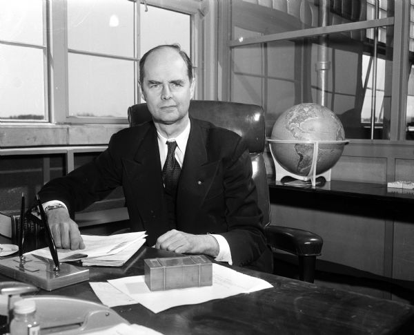 Portrait of Dr. Johan Bjorksten, President-Treasurer of Bjorksten Research Laboratories for Industry Inc. The headline for the article on the front page of the Wisconsin State Journal, April 22, 1955, states: "Man May Live 'Forever', Scientist Feels."