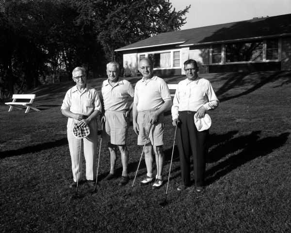 Carl Dietze, Milwaukee, president of the Senior Golf Association of Wisconsin, played a round of golf at the Blackhawk Country Club with three members of the club. They include, from left: Archie Kimball, Carl Dietz, Walter Rhodes, and Leon Isaksen. The state senior medal play tournament will be held at Blackhawk in June.