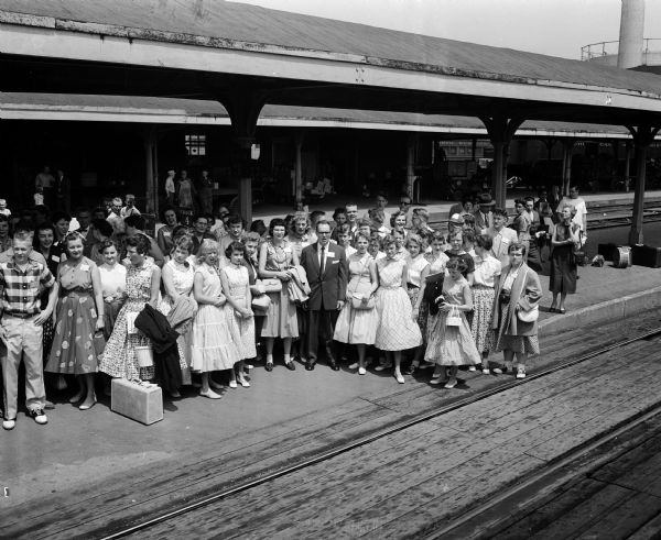 Elevated view of a group of youth from Bethel Lutheran Church waiting at the train station. Fifty-five youth from Bethel were going to San Francisco to attend the week-long biennial convention of the International Young People's Lutheran League.