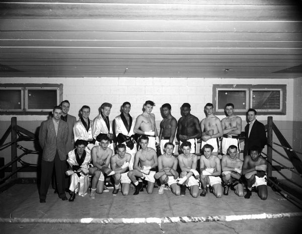 Group portrait of a squad of Golden Gloves boxers who work out at the Blessed Martin House at 1862 Beld Street. A tournament will be held to determine who will participate in the Kenosha Golden Gloves meet.