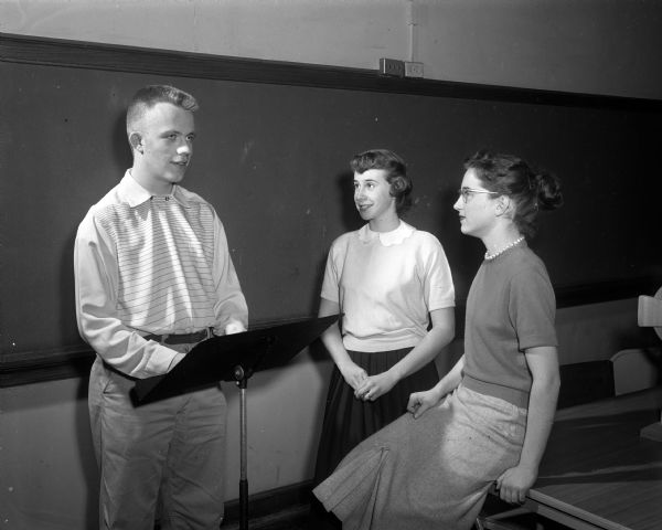 Gary Schultz, left, talks with Sally Lewis and Connie Platz. The three youth will participate in the Youth Sunday program at Westminster Presbyterian Church.