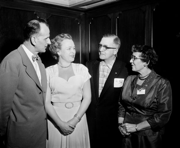 Visiting at the state meeting of the United Commercial Travelers insurance company are, left to right: George Frost, Madison; Velma Foust, Madison; John Scherer, Appleton and Emilye Loignon, Milwaukee.
