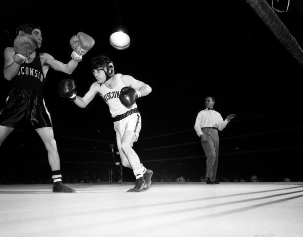 Bob Hennessy boxes against Chuck Hymore at 125 pounds. It was a split decision in the All-University boxing tournament.