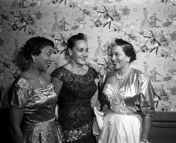 Three members of the Chicago Royalites Club at a cocktail and supper party in the Gold Room of the Playdium put on by the Madison Royalettes, an African American social and philanthropic club. They include, from left: Mrs. Billie Maxwell, Miss Lillian Kiethling and Mrs. Marva Lewis Spaulding. Mrs. Spaulding, the former Marva Trotter, is the ex-wife of Joe Louis, former world's heavyweight boxing champion.