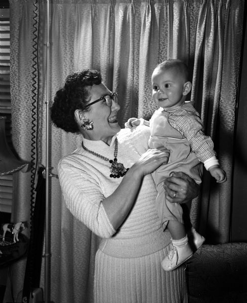 Myrtle Haywood and her 6-month old son, Skip, posing for a happy picture after she recovered from cataract surgery, and the baby recovered from prickly heat and flu.
