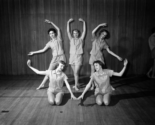 Portrait of five members of a modern dance group from West High School.