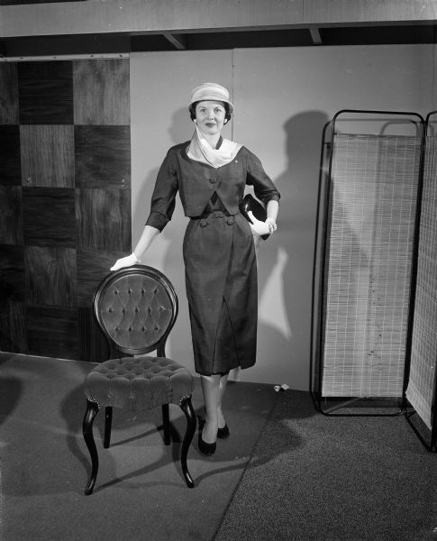 Barbara Lawson, representing the Truax Field Officers' Wives' Club, models fashion for the 'smart clubwomen.' The proceeds of the style shows were to maintain and further the services to those with cerebral palsy living in Madison and Wisconsin.