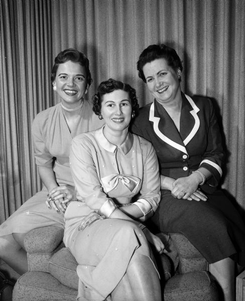 Group portrait of the annual dinner dance chairmen of the Women's Auxiliary to the Dane County Medical Society. The women include, from left: Ina Marlow, Elizabeth Maloof, and Mrs. A.P. Schoenenberger.