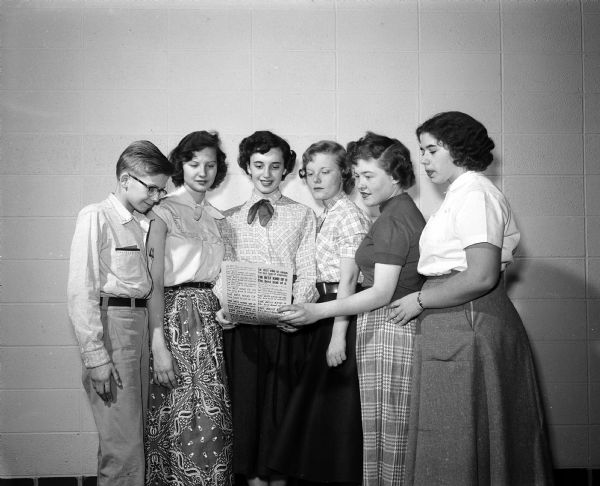 Portrait of the staff members of the first annual yearbook, the Silver Scroll, at Monona Grove High School. They are, left to right: Gene Rankin, Jerry Underwood, Virginia Raynoha, Judie Bohnsack, Sharon Ersland, and Jane Kirchoff.