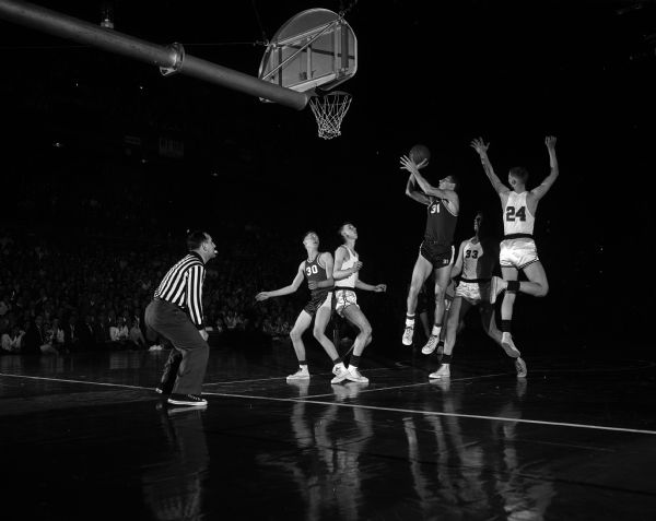 Sauk City's Francis "Shorty" Young made this shot and scored 29 points, but Shawano won with a 82-58 victory in Friday night's game at the State High School Basketball Tournament.