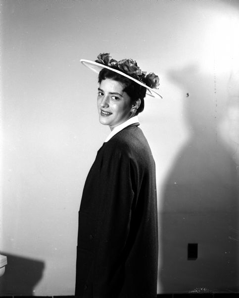 Portrait of Judith Diener wearing an Easter bonnet.