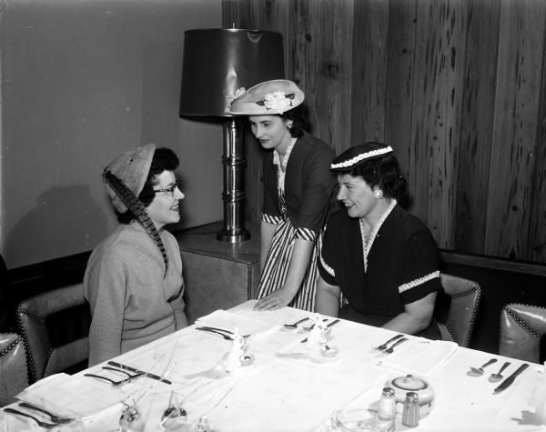 Three members of the table decoration committee for the Ladies Municipal Bowling Association Spring Luncheon are, from left: Maxine Sullivan, Josephine Severson, and Dorothy Olson.