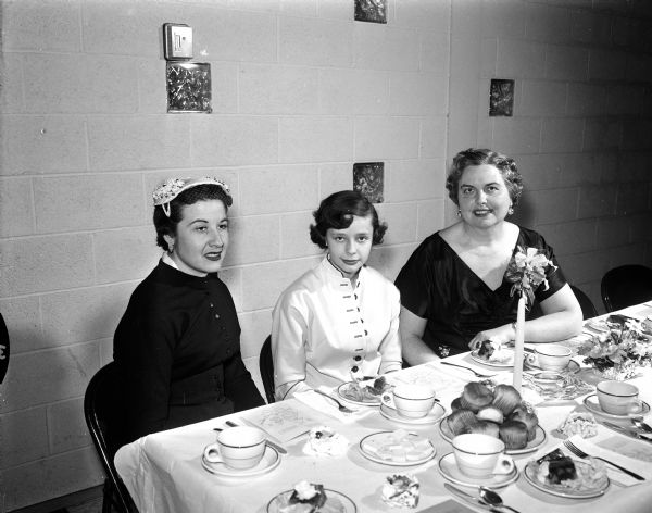Louise Marston (right) acts as speaker at a mother-daughter banquet at the East Side Women's Club. With her are Catherine Gedko, speaker for mothers, and Katheryn Morrison who responded for daughters.