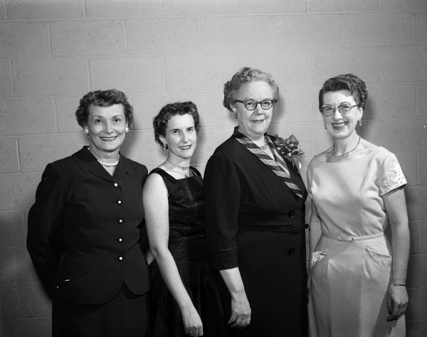 Group portrait of East Side Women's Club members who planned the mother-daughter banquet. They include, from left: Clara Ethun, Beverly White, Vera Browne, Leona Roman.