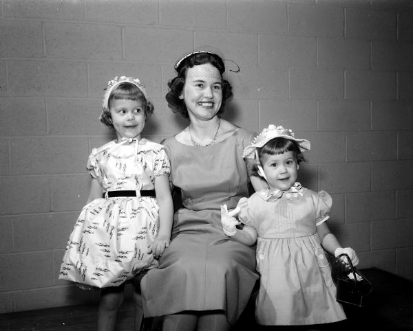 Typical guests at the mother-daughter banquet of the East Side Women's Club include Mrs. Jason Johnson, with her daughters O'Ann, 4, on left, and Marsha, 2, on right.