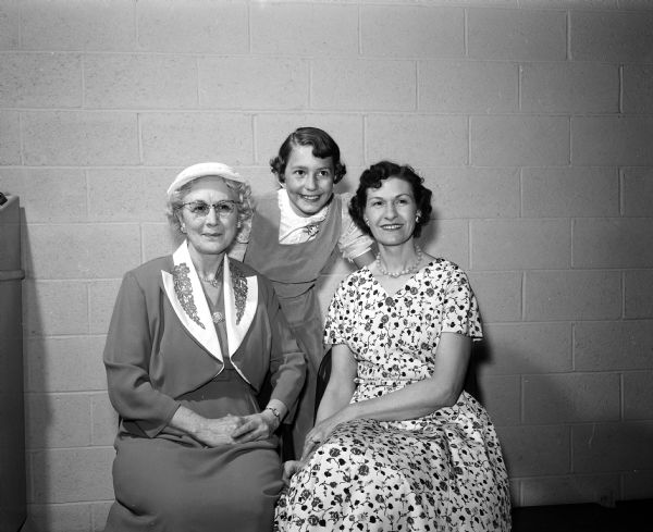 Portrait of a three generation group at the East Side Women's Club mother-daughter banquet, including (from left) Mrs. Detlev Heick (grandmother), Lynn Marie Jorgenson (age 10), and mother, Dorothy Jorgenson.