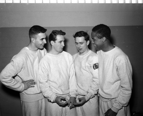 Madison West High School relay team at the Annual West Relays. Left to right: Dick Pearson, Ron Russell, Grant Tessman, and Harry Hamilton.