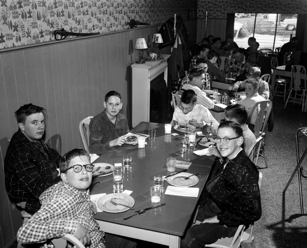 Madison Newspapers carrier boys were treated to breakfast at Felly's Restaurant, 927 South Park Street. Shown clockwise are: Bob Markham, John Washbush, Bill Pursell, Phil Goetz, Jack Seybold, and Ronald Nuehring.