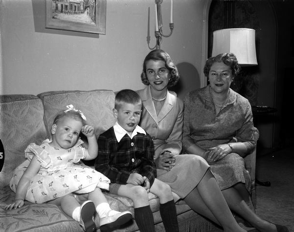 Three generation Mother's Day portrait of Violet Schneiders (grandmother), Betty Sonneland, Jr. (mother), with 4-year-old Arthur "Kim," and 19-month-old Kristin.