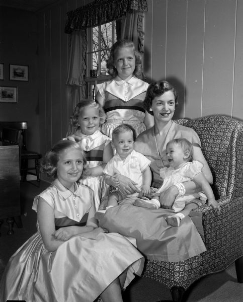 Mother's Day portrait of Marilyn Johnson with her five children. On her lap are 8-month-old twins, Kevin and Kim. Alongside her, bottom to top, are Kristi (8), Kaye (4 1/2), Karen (10).