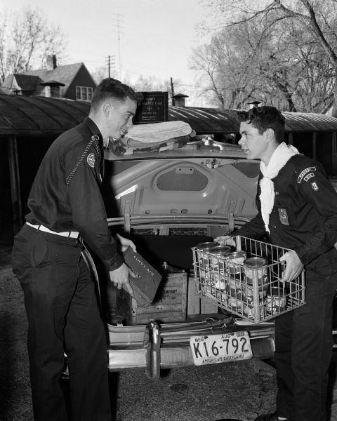 As part of a practice drill to prepare for possible disasters, Explorer Scouts David Ahlgren (left) and Richard Klatt rehearse delivering food, medical supplies, and blankets.