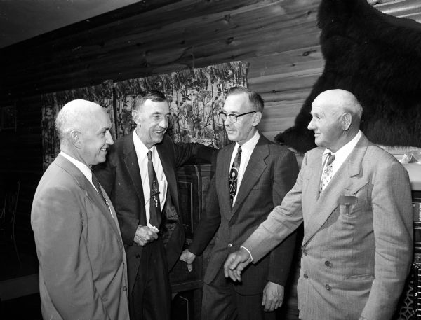 Four members of the Blackhawk Ski Club talk about the old days during a banquet at the Middleton Sportman's Club. Left to right are: Dave Schmitz, I.F. Statz, Art Norby, and Moritz Schorr.