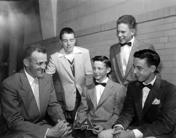Frank Allis School coach Les Wozney (left) smiles with some of his athletes during the school's annual athletic banquet. The student athletes, left to right, are: Fred Goold, Bob LaHale, Gary Rider, and Paul Kink.