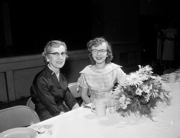 Seated at the speakers' table for the mother-daughter dinner at St. Bernard's Catholic Church are Mrs. Alfred E. (Mathida) Rathert, who gave the mother's toast, and Gerrie Schneider, who gave the daughters' toast.