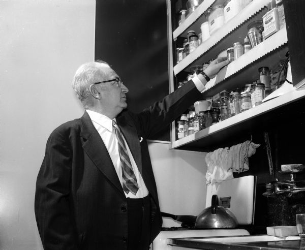 Mortimer Levitan is shown with his collection of herbs, spices and salts. He is also a cookbook collector.