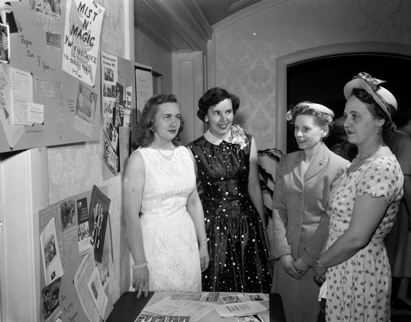 Assistant hostesses at the YWCA benefit tea for internationally speaking foreign students are left to right: Nan Rasmussen, Linda Bacon, Evelyn Gaumnitz and Mrs. Lindley J. Stiles.