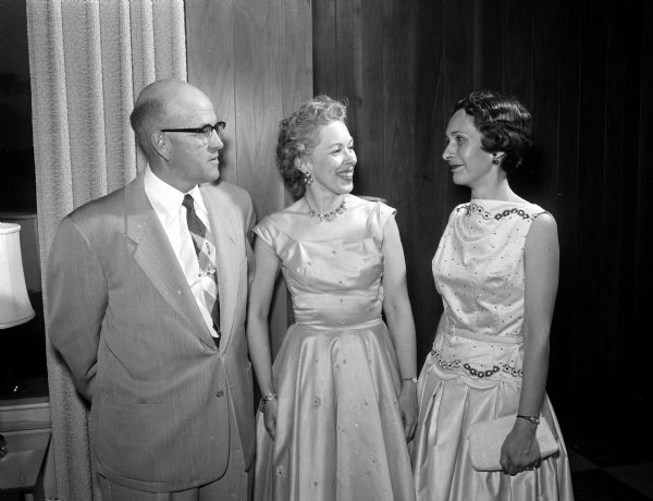 Chatting at the Cosmos Club dinner dance party are, left to right: John and Carol Kulp and Betty Densmore. 
