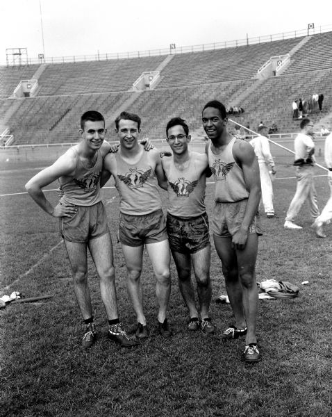 Group portrait of Madison West High School's relay team that helped the Regents win the Class A title in the state high school track meet at Camp Randall stadium. Left to right are: Dick Pearson, Ron Russell, Bob Glass and Henry Hamilton.