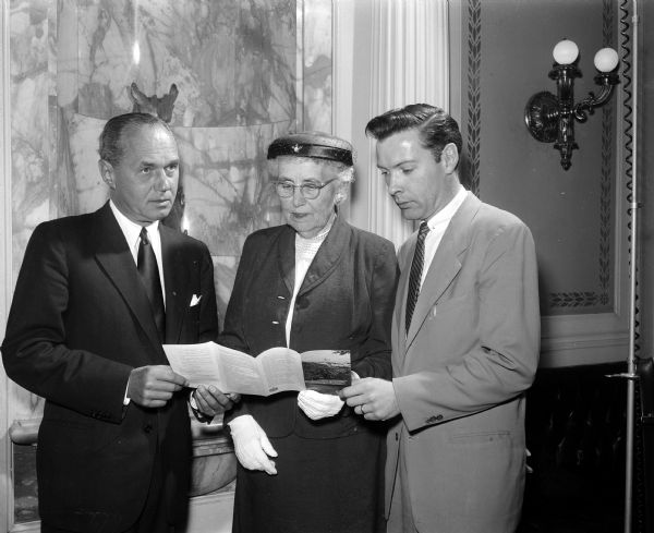 Discussing plans for the First Governor's Conference on an Aging Population are Governor Walter Kohler; Minnetta Hastings, chairman of the committee on the aging Community Welfare Council of Madison; and Robert McGee, associate executive secretary of the Wisconsin Welfare Council and one of the conference co-ordinators.