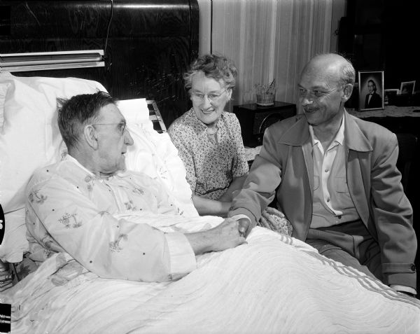 The First University Methodist Church has a friendly visitor plan where volunteers visit shut-ins of the church regularly. Leisure time activities are one of the topics of discussion at the First Governor's Conference on an Aging Population. Ben and Paepke visit bedridden stroke patient Robert Soule.