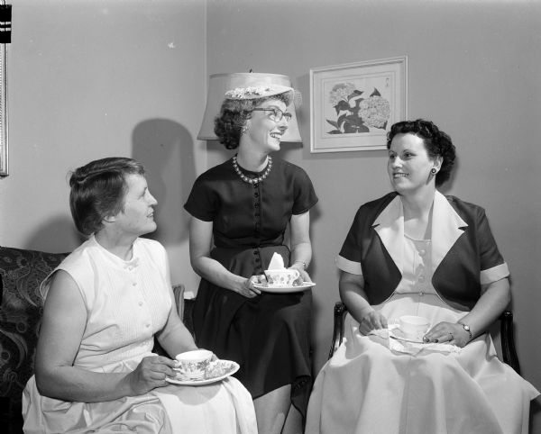 Three leaders of the Women's Division of United Givers confer. Left to right are: Mary Gill, Francis Bell, and Alice Pahl.
