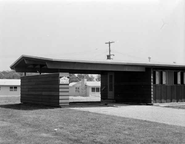 One of the houses in the Parade of Homes was built with a carport. This located at 5610 Raymond Rd.  The house was built by built by Hermann E. Postweiler for the 1956 Parade of homes.