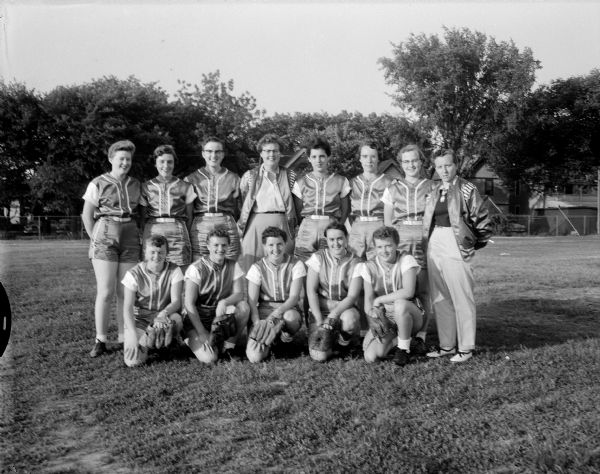Group portrait of the Hitch Post Women's Softball Team, representing Madison in the West Allis Girl's Classic Softball League.