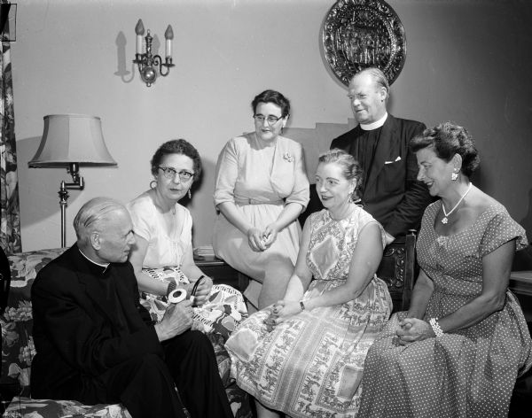 Group portrait of the staff members of the institute for summer church schools of the Episcopal Diocese of Milwaukee at St. Francis Episcopal Student Center, where the institute was conducted. Left to right: Rev. Albert Meerchoer, West Bend; Frances Whitnall, Milwaukee; Eleanor Nerdrum, Madison; Mrs. Walter Renzel, Madison; Rev. Gerald White, Madison; and Mrs. William Otto, Madison.