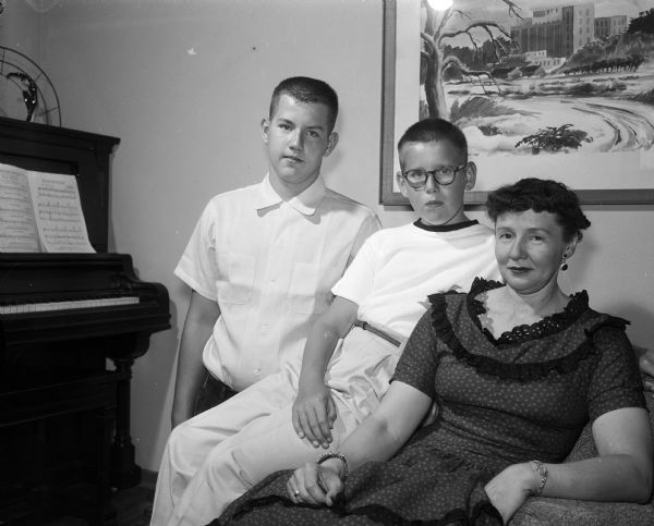 Mrs. S.P. Huntington sits with her two sons, Jack and Tom. They are from Pocatello, Idaho and are visiting her two sisters, Mrs. Victor Lanning and Mrs. Ivor S. McBeath.