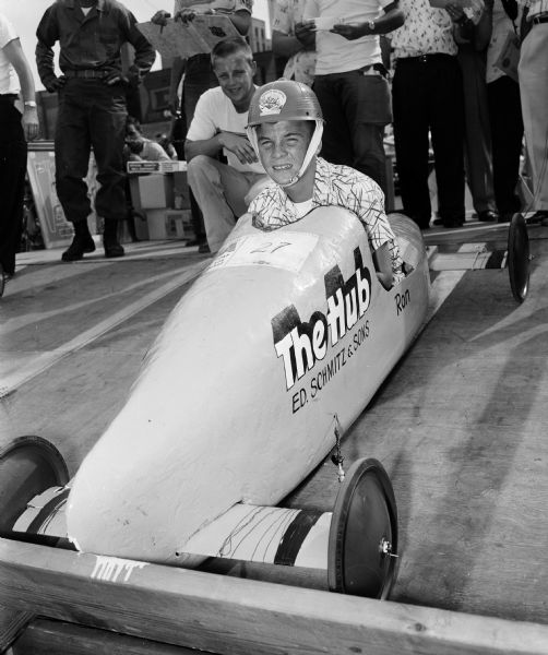 Ronnie Dommershausen, the "hard-luck guy" of the race, is shown just before his brake and steering apparatus jammed. He got as far as runner-up in Class A. Behind him is Pete Slightham, the 1949 champion.