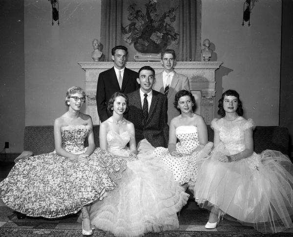 Portrait of "royalty" for the semi-formal dance of the Order of Rainbow for Girls and Order of DeMolay for boys ("Rai-Molay") held at the Masonic temple. Girls seated left to right: Sue Schermerhorn, Janette Gluth, Virginia Nordness, Jo Maes. Boys left to right: Wally Hoffman, Richard Togstad, Carl Fosmark.