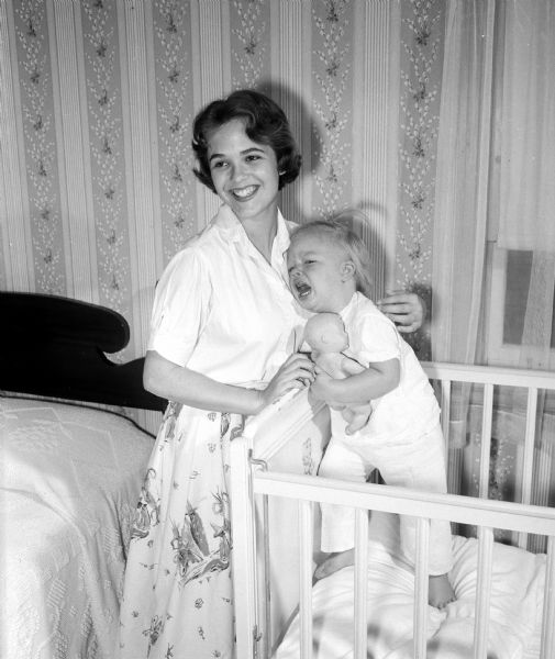 Babysitter Linda Taylor comforts Delia Charlton.