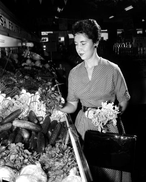 Joan Atwood shopping for vegetables for a special recipe. Part of photo spread for WSJ Centennial Cookbook contest.