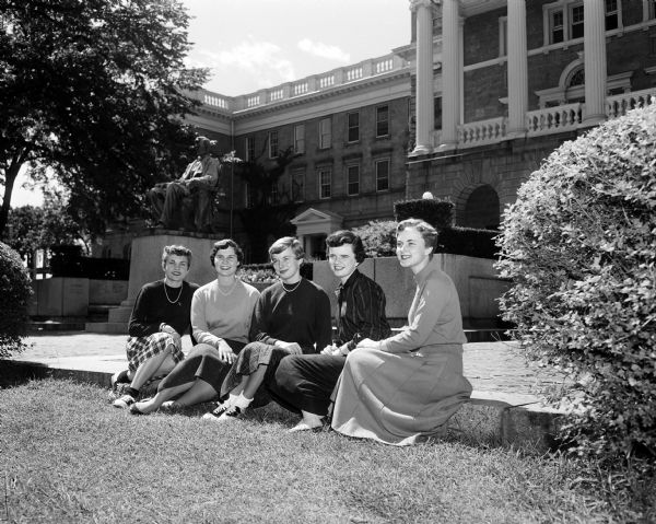 Five West High School graduates sitting in front of Bascom Hall on the University of Wisconsin campus. They will be attending colleges away from Madison. Left to right:  Kenlynn Heydon, Jean Dammann, Raynette Schwarm, Margaret McDowell, and Ann Holmgren.