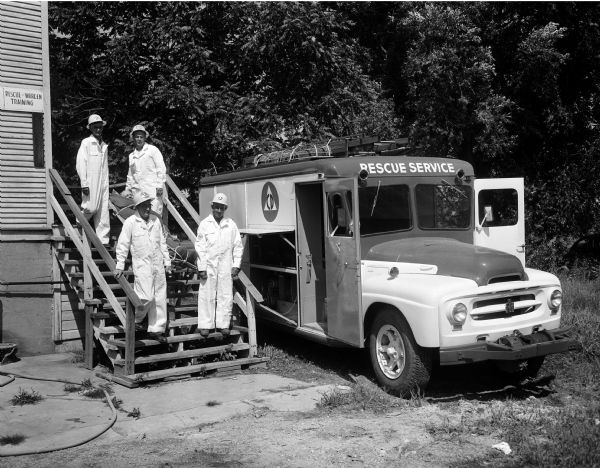 Four Madison city park department employees would go into action in case of enemy attack or any major-sized natural catastrophe. Pictured are Charles Breitake, upper left; Jack Gaumnitz, upper right; George Behrnd, lower left; and Clifford Schnering, lower right. The $12,000 heavy duty rescue operation truck was purchased with matching funds from the federal government.