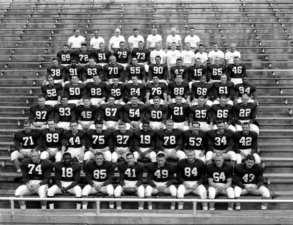 Group portrait of the players and coaches of the University of Wisconsin football squad.